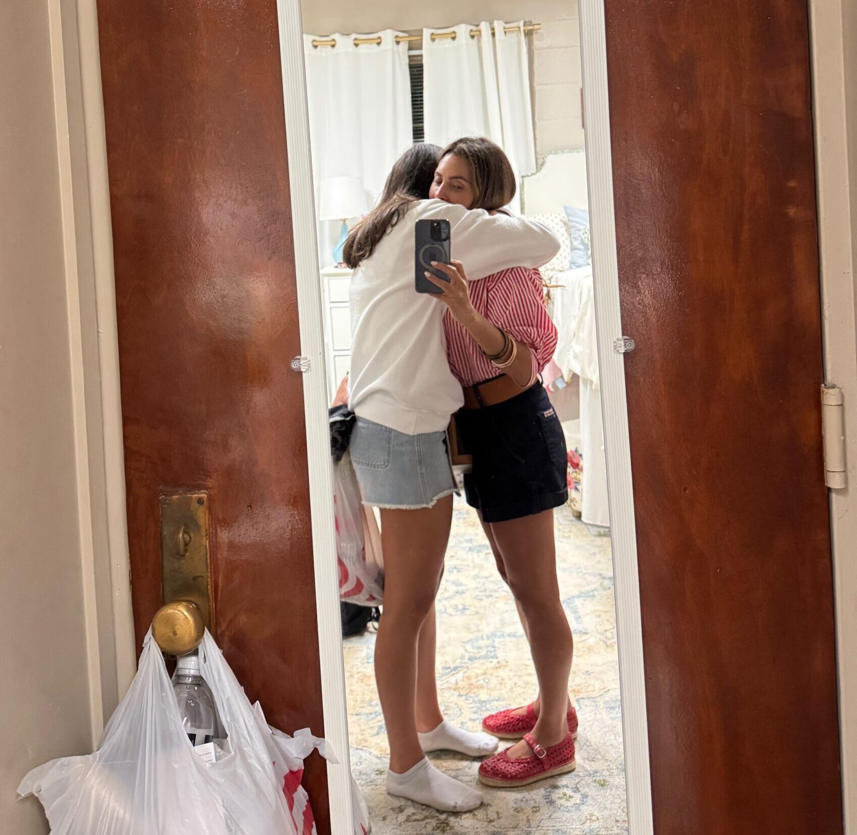 Mother hugging her daughter before leaving her at college, symbolizing love, humility, and the possibility of healing and restoration in parent-child relationships.