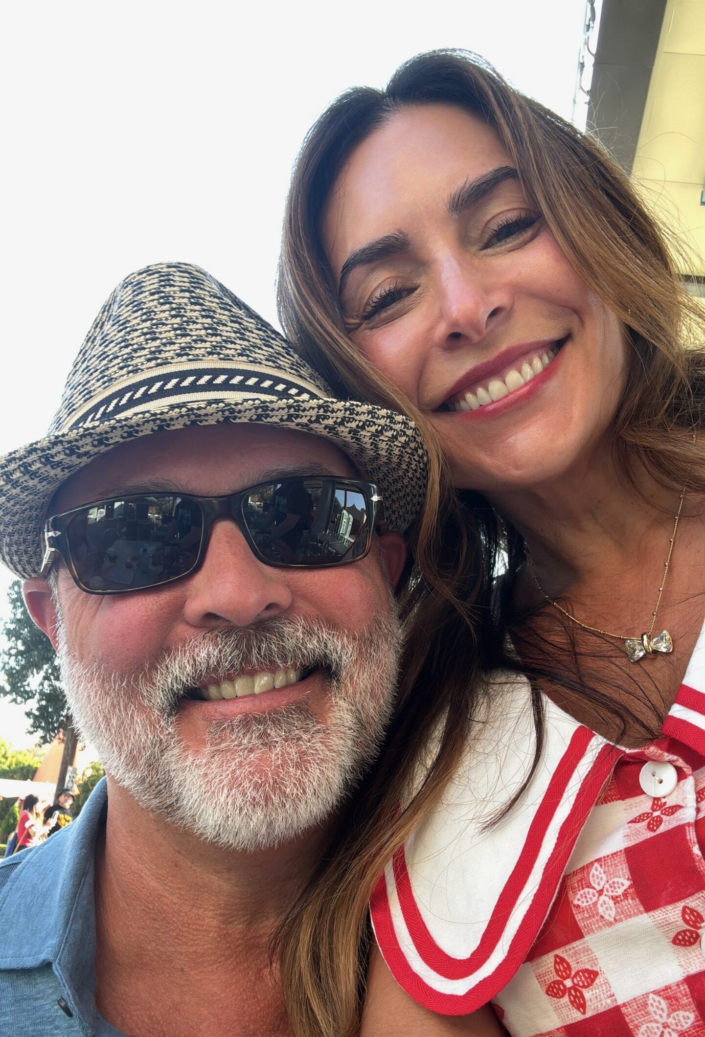 Danielle Alvarez Greer and her husband smiling together at Disney California Adventure, representing connection, reconciliation, and healthy repair in marriage.